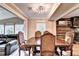 Dining room with wood table, seating for six, and view to the living room at 4364 Saddlecreek Ct, Auburn, GA 30011