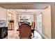 Dining room leading to a kitchen with stainless steel appliances and tile flooring at 4364 Saddlecreek Ct, Auburn, GA 30011