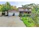 Charming home with a two-car garage and inviting front yard landscaping at 4364 Saddlecreek Ct, Auburn, GA 30011