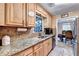 Kitchen with granite counters, stainless appliances, view to the dining room at 4364 Saddlecreek Ct, Auburn, GA 30011