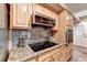 Bright kitchen with cooktop and stainless steel appliances, and granite countertops at 4364 Saddlecreek Ct, Auburn, GA 30011