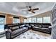 Bright living room with a ceiling fan, large windows, and comfortable furniture for relaxing at 4364 Saddlecreek Ct, Auburn, GA 30011