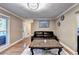 Open-concept living area with hardwood floors, a comfortable sofa, and a seamless transition to the entryway at 4364 Saddlecreek Ct, Auburn, GA 30011