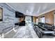 A cozy living room featuring a tv, a sofa, and a sliding glass door for outdoor access at 4364 Saddlecreek Ct, Auburn, GA 30011