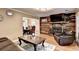 Warm and inviting living room featuring a stone fireplace, hardwood floors, and an open layout at 4364 Saddlecreek Ct, Auburn, GA 30011