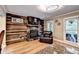 Cozy living room with hardwood floors and a fireplace at 4364 Saddlecreek Ct, Auburn, GA 30011