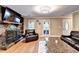 Living room featuring hardwood floors and a large stone fireplace at 4364 Saddlecreek Ct, Auburn, GA 30011