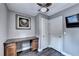 This home office features a built in desk and a window that overlooks the backyard at 4364 Saddlecreek Ct, Auburn, GA 30011
