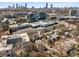 An aerial view with city skyline in the background and trees in the foreground at 540 Woodall Ne Ave, Atlanta, GA 30306
