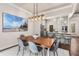 Open dining room and kitchen with stainless steel appliances and hardwood floors at 540 Woodall Ne Ave, Atlanta, GA 30306