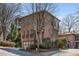 A stately brick home with a two-car garage and well-maintained landscaping at 540 Woodall Ne Ave, Atlanta, GA 30306