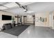 Spacious garage with custom gym equipment, storage cabinets, and ample space for vehicles at 540 Woodall Ne Ave, Atlanta, GA 30306