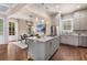 Open kitchen boasts an island, stainless appliances, hardwood flooring, and adjacent dining area at 540 Woodall Ne Ave, Atlanta, GA 30306