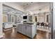 Spacious open-concept kitchen and living area with a large island, modern lighting, and hardwood floors at 540 Woodall Ne Ave, Atlanta, GA 30306