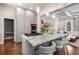 Bright kitchen features a large island with bar seating, granite countertops, and stainless steel appliances at 540 Woodall Ne Ave, Atlanta, GA 30306