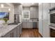 Updated kitchen with stainless steel appliances, granite countertops, and custom gray cabinetry at 540 Woodall Ne Ave, Atlanta, GA 30306