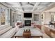 Open living room with coffered ceilings, fireplace, and french doors leading to the outside at 540 Woodall Ne Ave, Atlanta, GA 30306
