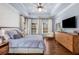 Serene main bedroom with tray ceiling, hardwood floors, and large windows at 540 Woodall Ne Ave, Atlanta, GA 30306