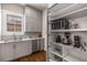 Walk-in pantry features custom shelving, granite countertop, and ample storage space at 540 Woodall Ne Ave, Atlanta, GA 30306
