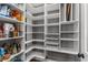 Large walk-in pantry provides lots of functional shelving to maximize kitchen storage at 540 Woodall Ne Ave, Atlanta, GA 30306