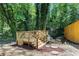 Inviting backyard deck with wood railings provides a tranquil retreat nestled within lush greenery and a small creek at 2392 Jefferson Ter, Atlanta, GA 30344