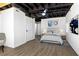 Finished basement bedroom with modern decor, ample space, and a ceiling fan at 2392 Jefferson Ter, Atlanta, GA 30344