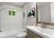 Modern bathroom with sleek tile, stylish fixtures, and a bright window at 2392 Jefferson Ter, Atlanta, GA 30344