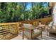 Inviting deck area with stylish outdoor furniture, ideal for enjoying the serene green surroundings at 2392 Jefferson Ter, Atlanta, GA 30344