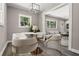 Bright dining room with modern decor, stylish furnishings, and large windows at 2392 Jefferson Ter, Atlanta, GA 30344