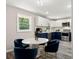 Stylish kitchen featuring a modern dining area, white and blue cabinets, and stainless steel appliances at 2392 Jefferson Ter, Atlanta, GA 30344