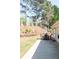 Lush backyard with a patio and outdoor dining area at 310 Morning Glen Dr, Suwanee, GA 30024