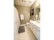 Cozy bathroom with a shower, toilet, a mirror, and white cabinets at 310 Morning Glen Dr, Suwanee, GA 30024
