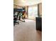 Well-lit bedroom features a loft bed, a window, and neutral carpeting at 310 Morning Glen Dr, Suwanee, GA 30024