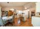Bright kitchen with white appliances, a center island, and a view of the breakfast area at 310 Morning Glen Dr, Suwanee, GA 30024