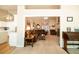 Open-concept living room connecting to the kitchen, featuring comfortable seating and natural light at 310 Morning Glen Dr, Suwanee, GA 30024