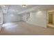 Finished basement with carpet, recessed lighting, and a staircase leading to the upper floors at 3958 Windgrove Xing, Suwanee, GA 30024