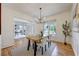 Open dining room with hardwood floors, natural light, and views into the living area at 3958 Windgrove Xing, Suwanee, GA 30024