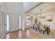 Inviting entryway with hardwood floors, open to the dining room at 3958 Windgrove Xing, Suwanee, GA 30024
