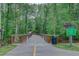 Picturesque greenway featuring a charming wooden bridge with protective railings amidst lush greenery at 3958 Windgrove Xing, Suwanee, GA 30024
