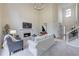 Open living room with fireplace, staircase, and lots of natural light at 3958 Windgrove Xing, Suwanee, GA 30024
