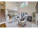 Open floor plan with fireplace, lots of natural light, and access to kitchen at 3958 Windgrove Xing, Suwanee, GA 30024