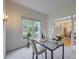 Bright office with neutral decor, a modern desk, and views of the lush outdoors at 3958 Windgrove Xing, Suwanee, GA 30024