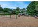 Community playground with swings, slides, and a soft ground surface for safe and fun play at 3958 Windgrove Xing, Suwanee, GA 30024