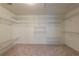 Spacious walk-in closet featuring multiple shelves at 3958 Windgrove Xing, Suwanee, GA 30024
