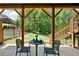 Cozy outdoor patio area with chairs and table at 409 Retreat Ln, Canton, GA 30114