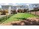 The grassy backyard features a black metal fence offering privacy and definition to the outdoor space at 409 Retreat Ln, Canton, GA 30114