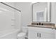 Clean and modern bathroom with a shower/tub combo and a vanity with storage at 409 Retreat Ln, Canton, GA 30114