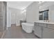 Luxurious bathroom with a freestanding tub, double vanities, and a separate glass-enclosed shower at 409 Retreat Ln, Canton, GA 30114