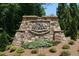 Stone community sign for The Retreat with landscaping and flowers at the entrance at 409 Retreat Ln, Canton, GA 30114