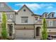 Charming townhouse with neutral siding, brick accents, a two-car garage, and manicured landscaping at 409 Retreat Ln, Canton, GA 30114